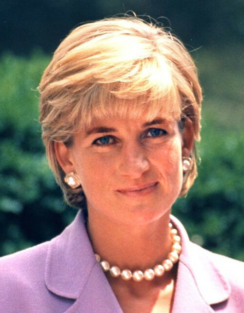 Princess Diana smiling at a public appearance in 1997