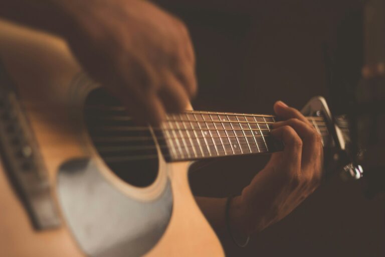 Electric guitar resting in a dimly lit room